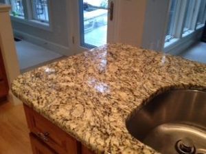 Installing granite countertops as part of a kitchen makeover project.