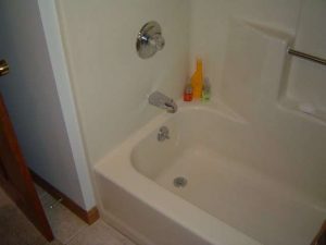 A tub drain could be the source of odd water leaking sounds in wall.