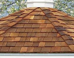Installing cedar roof shingles.